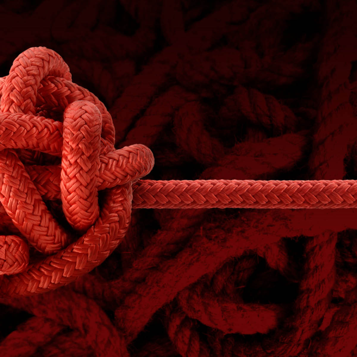 unraveling ball of rope on red background